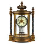 Brass and champleve enamel clock, late19th Century, the case of architectural design with flaming