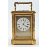Brass carriage clock by Henri Jacot, the case with turned reel columns to the corners,