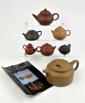 A Yixing teapot of cylindrical form; together with a related Yixing catalogue from Sheung Yu