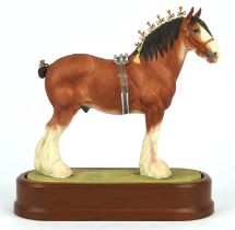 Doris Lindner, a Royal Worcester porcelain model of the Clydesdale Stallion, on a wooden stand,