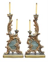 A pair of Italian gilt and painted wood two light candelabra, elements 18th Century,