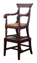 Regency child's mahogany high chair, mounted on a stand with tapered legs, the chair with a curved
