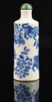 A Chinese porcelain blue and white snuff bottle of cylindrical form, decorated with four