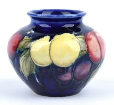 Moorcroft, Wisteria vase of squat ovoid design, impressed and printed marks to base, 7cm high