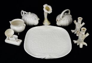 A Belleek hippocamp and shell stand, an orchid form vase, two teapots, with covers,