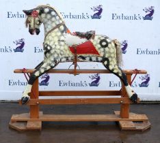 A rocking horse, 20th Century, painted and decorated with decorative grey and white patches,