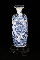 A small Chinese blue and white vase decorated with floral designs