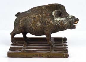 Continental bronze sculpture of a boar, late 19th Century, standing on a fence or gate, 8.5cm high