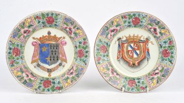 An associated pair of Samson, or other, famille rose armorial dishes; each one with trapezoid