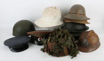 Collection of various military and other helmets and caps (11)