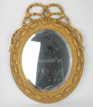 Victorian giltwood and gesso mirror, George III style, the bevelled plate within an oak leaf carved