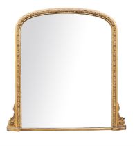 Victorian giltwood and gesso over mantle mirror of arched form, the moulded frame with flower head