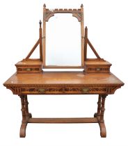Manner of Charles Bevan, a Gothic oak and geometrically inlaid dressing table, with central