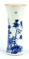 A blue and white trumpet vase, decorated with a bird perched on a flowering peony branch; 21.