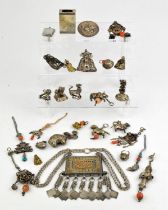 A number of Asian or other white metal sculpture, applique, or small cabinet objects,