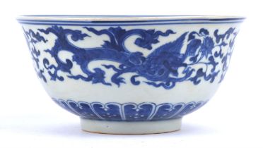 A blue and white bowl, decorated on the exterior, and the interior with mythological creatures;
