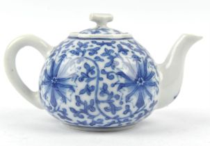 A blue and white teapot, decorated with formal lotus and scrolling foliage; 14.5 cm wide; the base