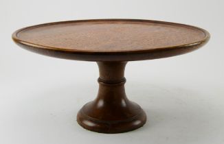 An Edwardian oak lazy susan, with dished top and pedestal base, diam.40cm, together with a large