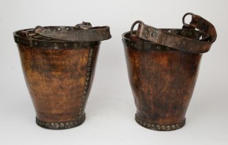 Pair of leather fire buckets, 19th Century, with ring and strap handles, with nailed decoration,