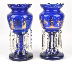 Pair of late Victorian blue glass and gilt decorated lustres H 36cm ( some prisms and drops