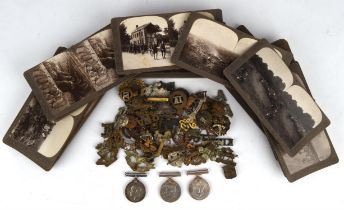 Collection of regimental cap badges, shoulder badges and pips, and a collection of Realistic