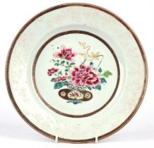 A famille rose dish of circular form, decorated with peony at the centre and bianco-sopra-bianco