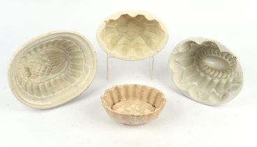 Large Collection of white pottery jelly moulds of various form(approx 23) Charity lot - This lot