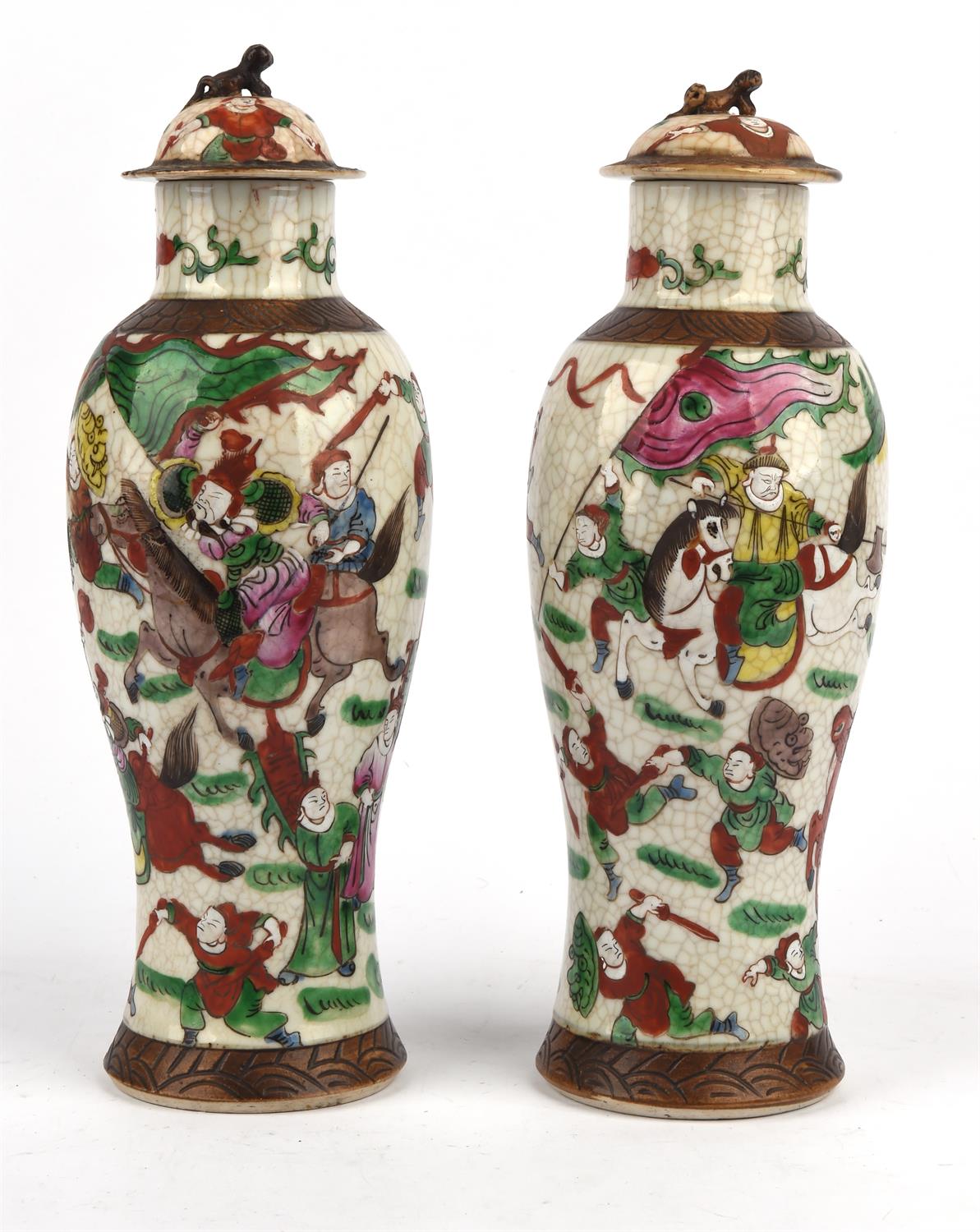 A Pair of famille rose vases and covers, late Qing Dynasty or later, decorated with friezes of