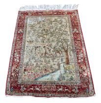 Persian/North Indian rug, mid 20th century, woven with a scene of stag and deer in a natural