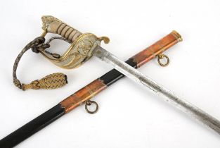Naval officers dress sword, the blade etched with royal cypher and anchor, brass hilt with folding