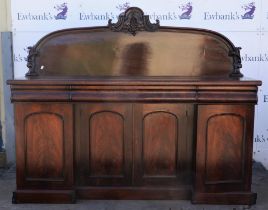 Mahogany sideboard, 19th Century, with arched foliate carved back, above one long flanked by two
