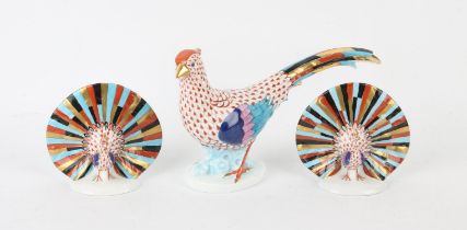 Two Herend porcelain peacocks, 11cm high and a Herend porcelain pheasant, 33cm long (3)