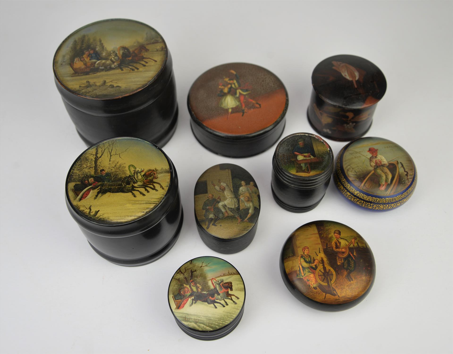 Collection of seven Russian papier-mache boxes, late 19th/early 20th century, depicting various
