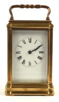 Late 19th / early 20th century brass and glass carriage clock striking on a coiled gong,