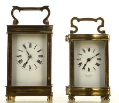 A French brass cased carriage clock, the corners fluted and with bevelled glazed panels,