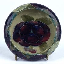 William Moorcroft (British, 1872 - 1945) for Moorcroft a small dish of circular form with curved