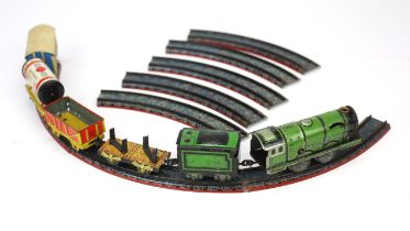 Vintage miniature clockwork railway. Train with rolling stock and circular track.