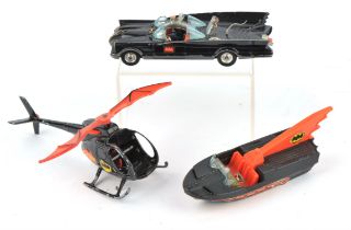 A collection of play worn toy cars. Including Corgi Batmobile, Corgi BatBoat, and Batman Helicopter.