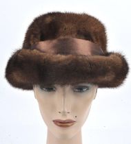 Bespoke-made ladies soft brown mink or possibly sable après-ski fur hat with satin band and bow.