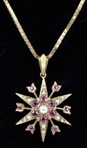 Vintage ruby and seed pearl star pendant, in 9 ct gold, hallmarked London 1973, measures 22mm,