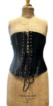 RIGBY & PELLOR black satin steel-boned corset approx. 30" waist. Fastens with hooks and eyes.