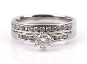 Modern diamond ring, centrally set with a round brilliant cut diamond, estimated weight 0.50 carats,