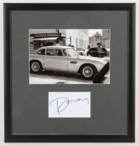 James Bond - Daniel Craig signed card in a framed display, overall 17 x 16 inches.