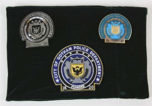The Dark Knight Rises (2012) – a group of three Gotham Police Department badges, two being metal