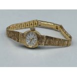 Ladies 9ct gold Rotary watch with tree bark affect. 15.7g