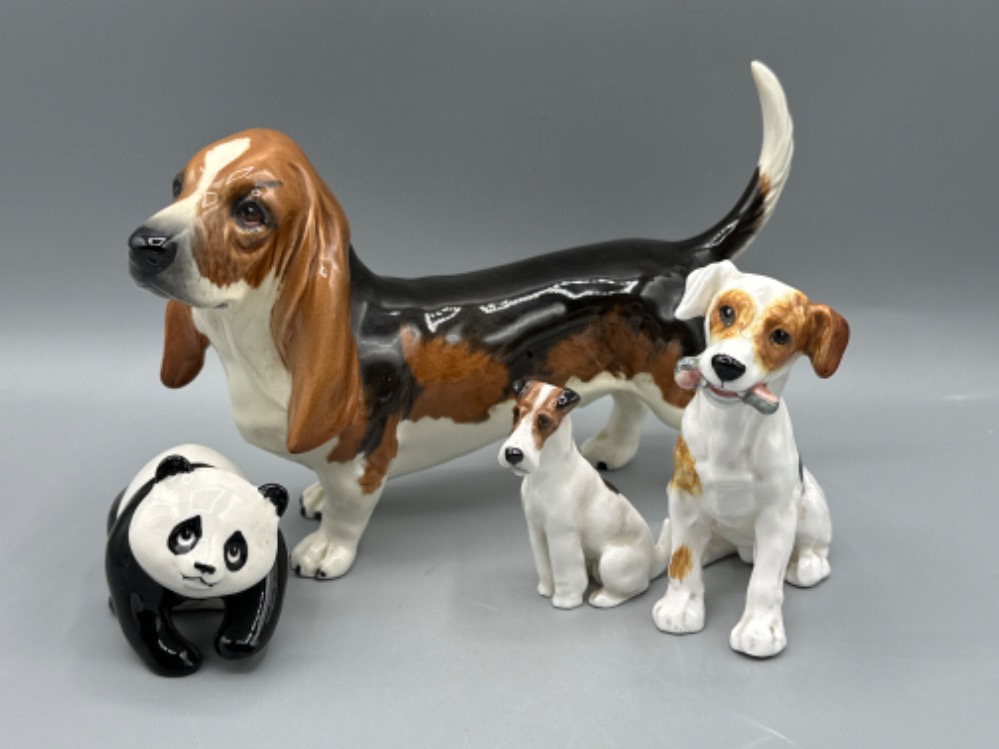 Beswick Basset Hound & Beswick Panda, together with two Royal Doulton dogs
