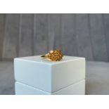 A 9ct Yellow Gold Citrine Ring - made up of 15 individual stones - Weighing 4.77 grams - Size P