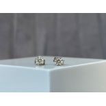 A pair of 14ct White Gold Diamonds Stud Earrings Approximately .25cts each
