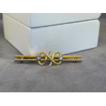 18ct Yellow Gold Fancy Style Brooch featuring two approximate .05ct diamonds - weighing 4.74 -