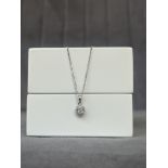 A 18ct White Gold Diamond Pendant on Chain Comprising of .25cts total - Weighing 1.74 grams -